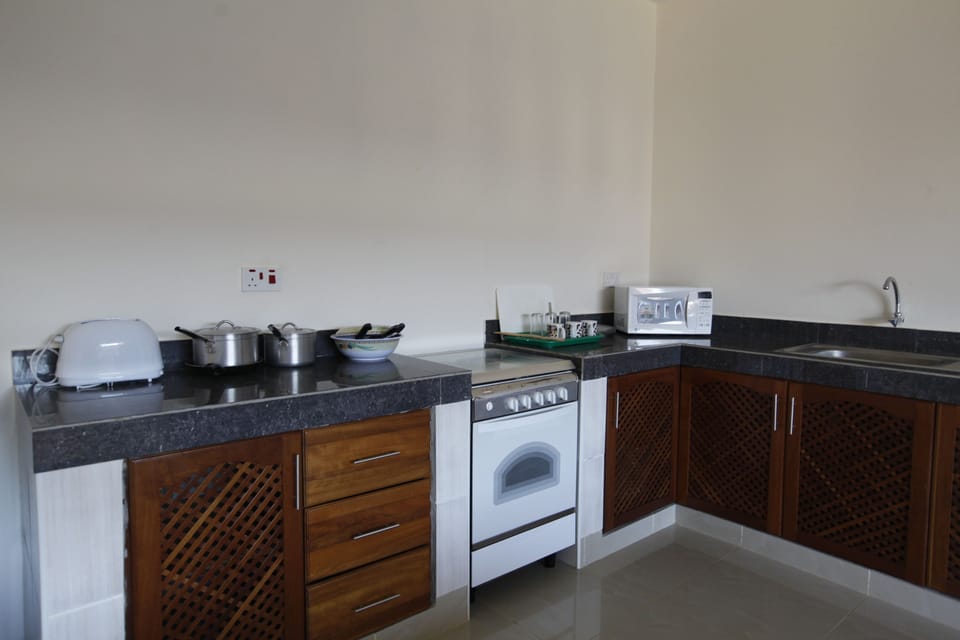 Basic Apartment, Pool View | Private kitchen | Full-size fridge, microwave, stovetop, cookware/dishes/utensils