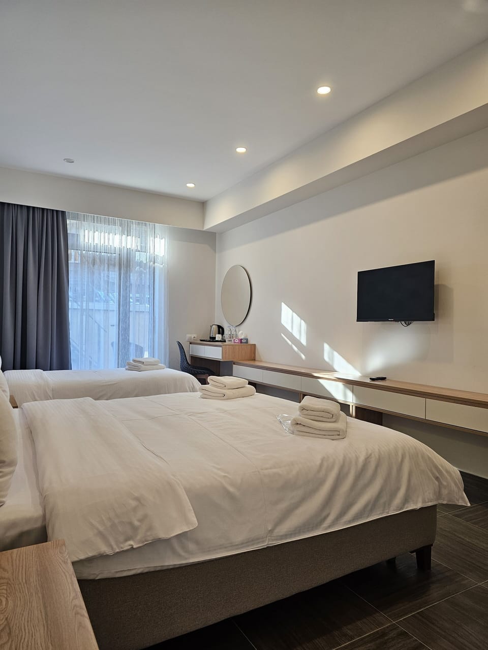 Deluxe Triple Room, Patio (Ground floor) | Egyptian cotton sheets, premium bedding, down comforters, in-room safe