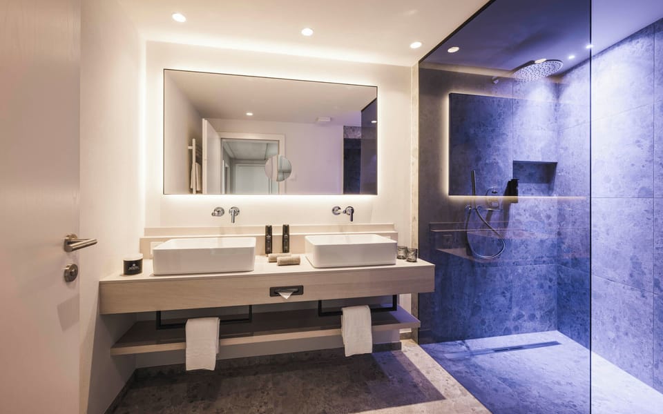 Family Suite | Bathroom | Shower, rainfall showerhead, hair dryer, bathrobes