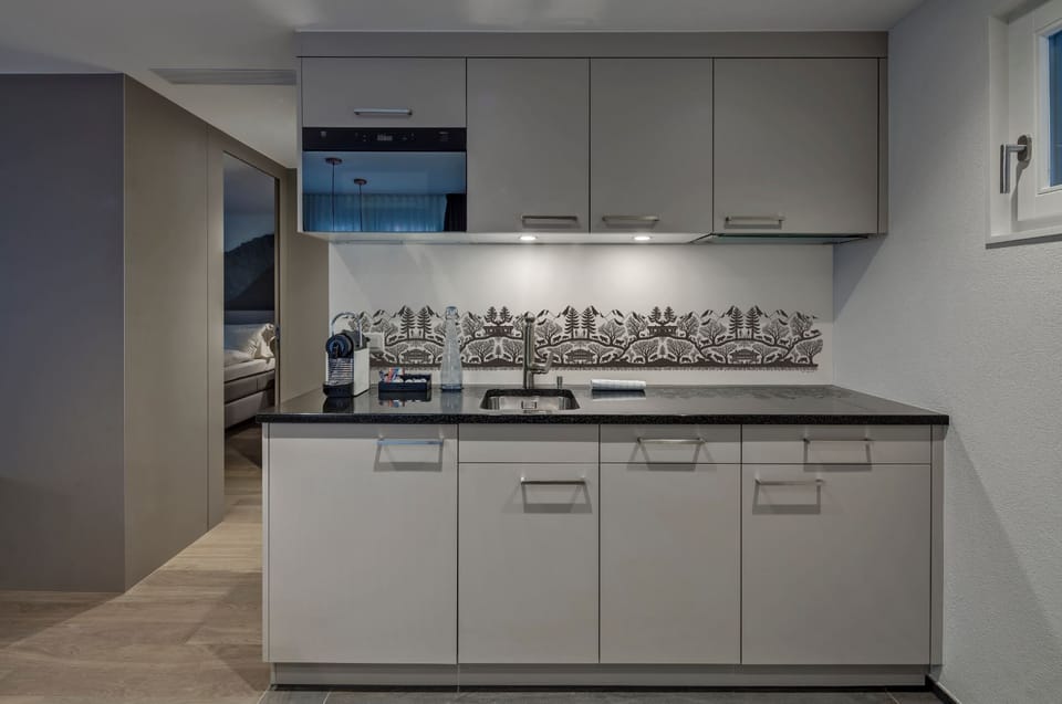 Family apartment with A/C, 1 large bed, livingarea with kitchen | Private kitchen | Mini-fridge, espresso maker, coffee/tea maker