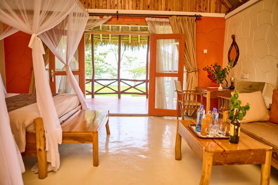 Grand Cottage, 1 Queen Bed, Lake View | Living area | 40-inch flat-screen TV with premium channels