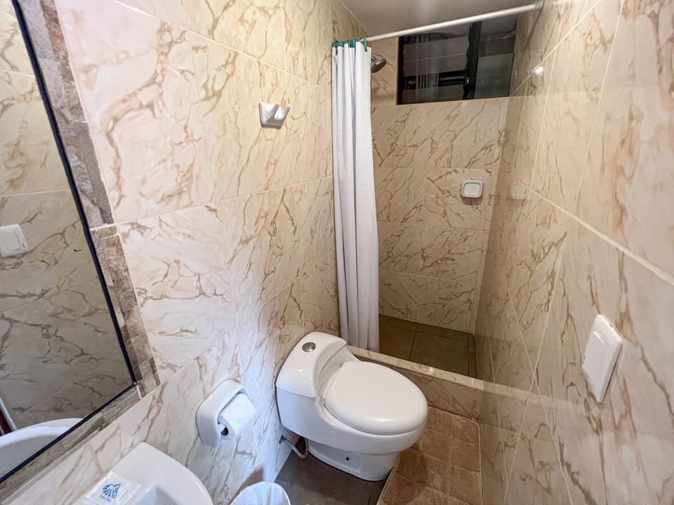 Comfort Twin Room | Bathroom | Shower, rainfall showerhead, free toiletries, hair dryer (on request)