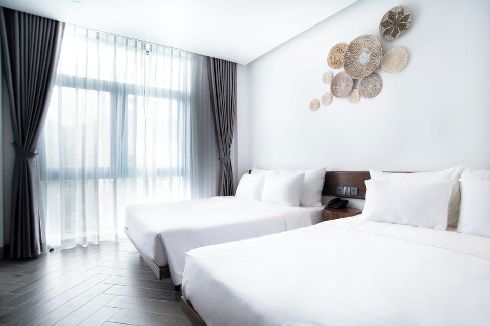 Deluxe Quadruple Room, 2 Queen Beds, Non Smoking, Mountain View | Premium bedding, pillowtop beds, minibar, in-room safe