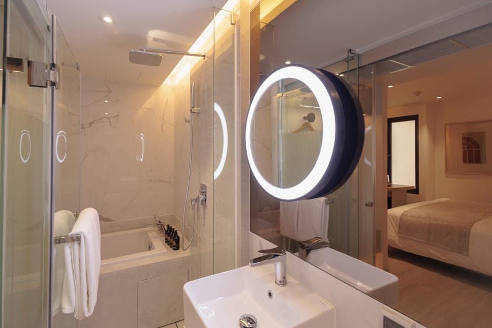 Premium Room with Bath or Soaking Tub | Bathroom | Combined shower/tub, rainfall showerhead, free toiletries, hair dryer