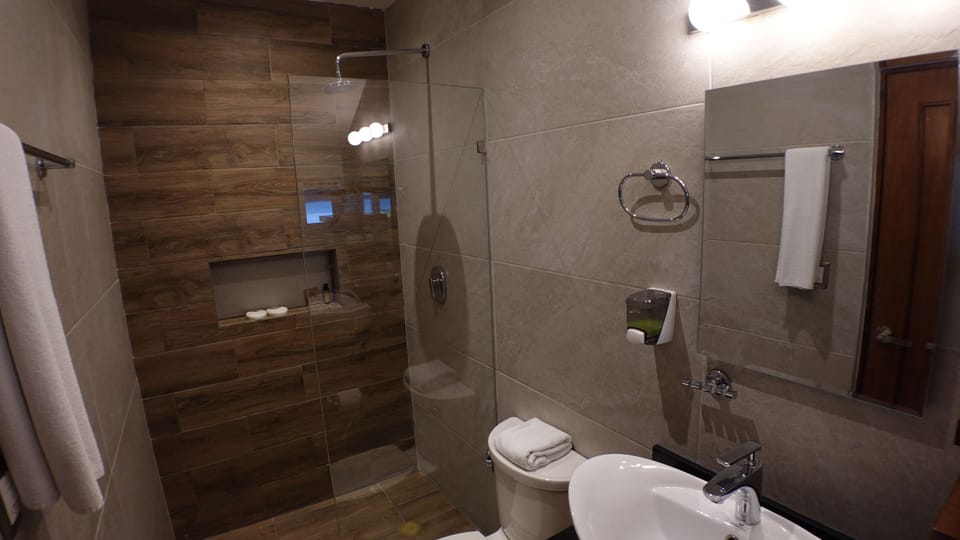 Apartment, 2 Bedrooms, Balcony, Ocean View | Bathroom | Shower, rainfall showerhead, hair dryer, towels