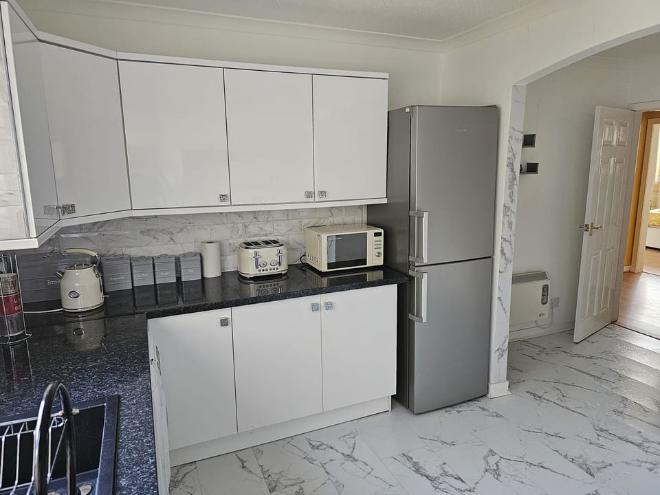Apartment | Private kitchen | Full-size fridge, microwave, oven, stovetop