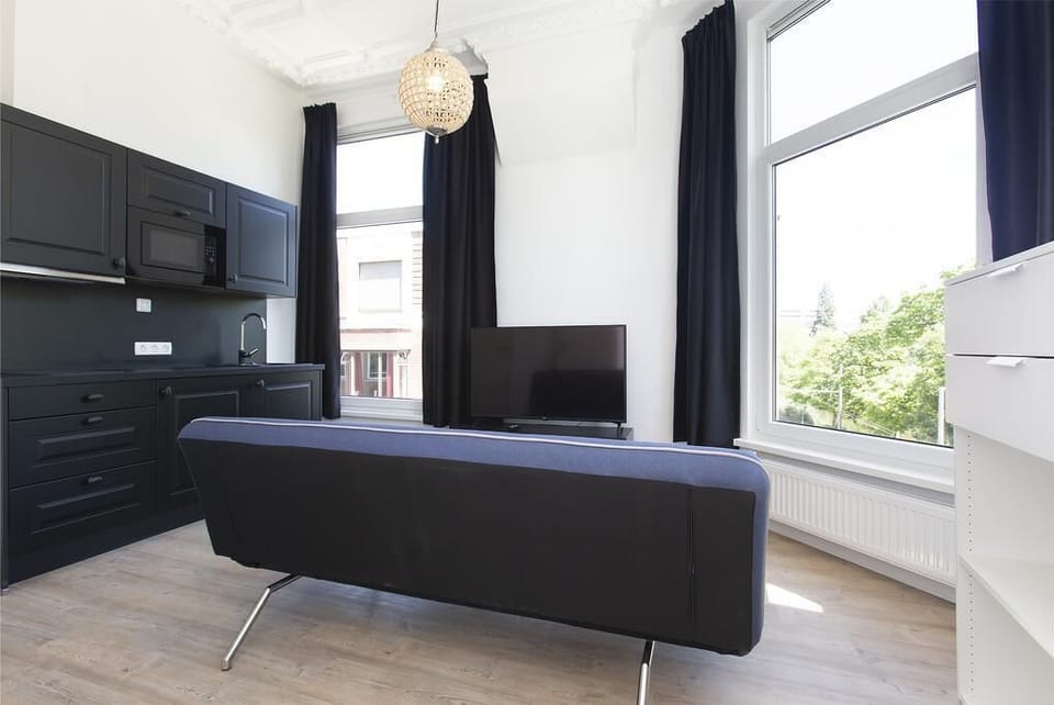 City Apartment , 1 Queen Bed with Sofa bed, Lakeside, apartment 2 | Living area | TV