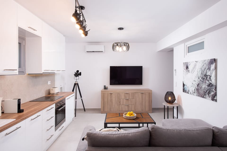 Economy Apartment, Private Bathroom | Living area | 55-inch Smart TV with digital channels, Netflix, streaming services