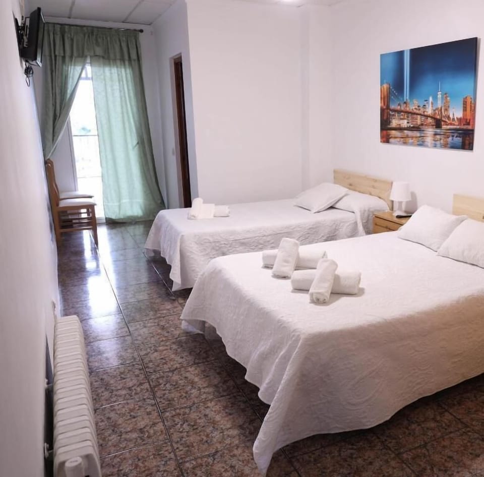 Comfort Triple Room | Down comforters, memory foam beds, individually decorated