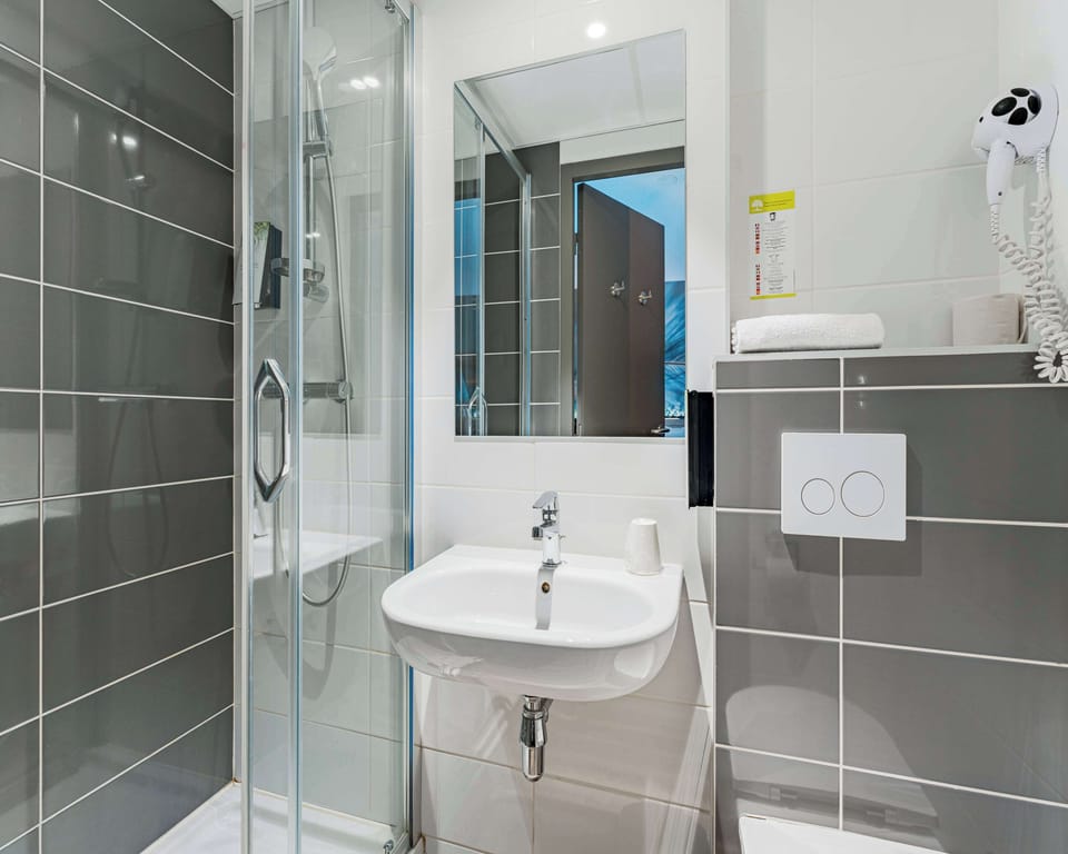 Shower, eco-friendly toiletries, hair dryer, towels