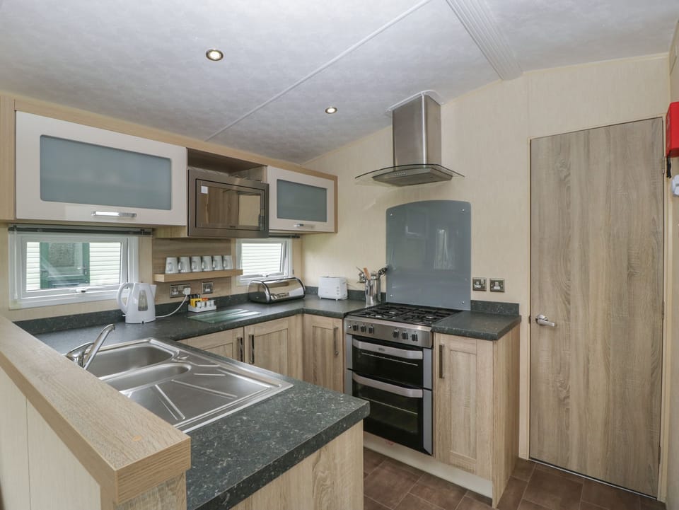 Fridge, electric kettle, toaster, cookware/dishes/utensils