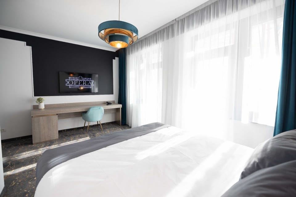 Deluxe Room, 1 Queen Bed | Living area | 128-cm Smart TV with cable channels, printers