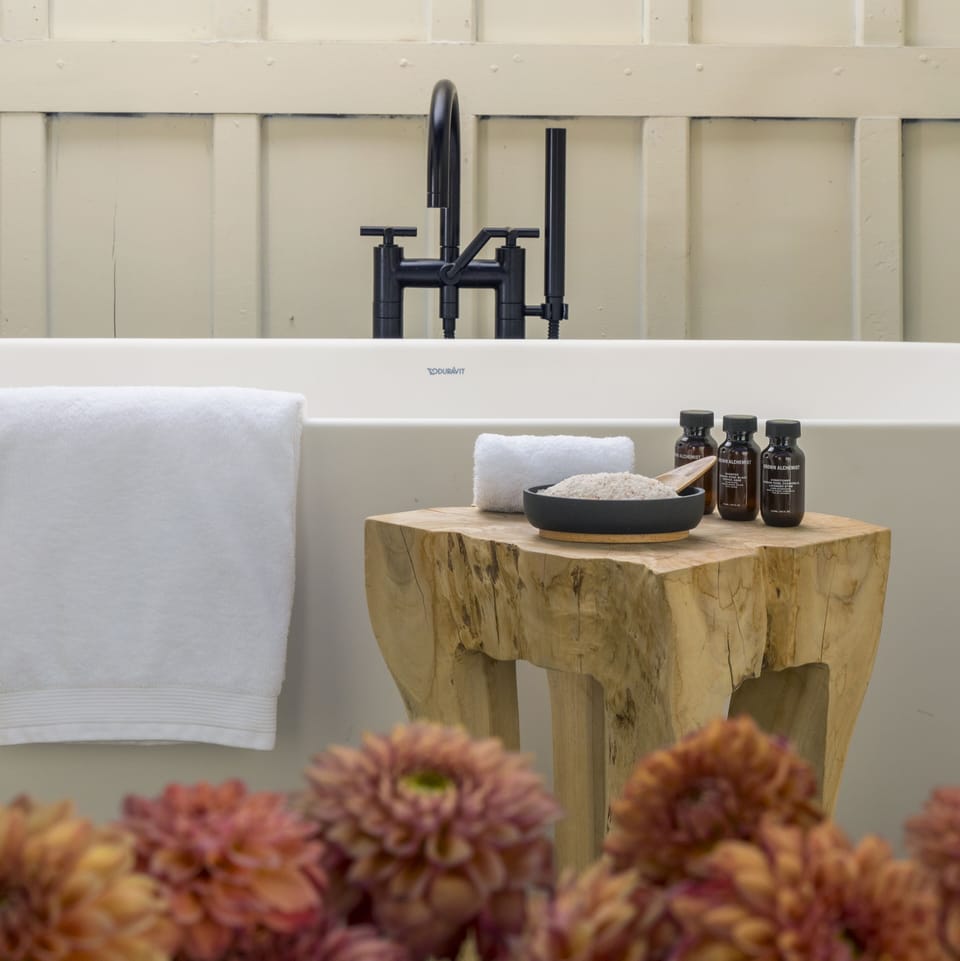 Designer toiletries, hair dryer, bathrobes, slippers