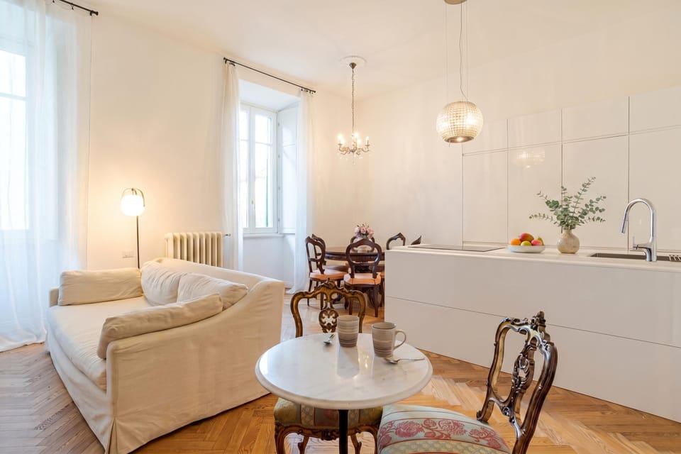 Family Apartment, Multiple Bedrooms (Appartamento Reggenza) | Living area | 21-inch flat-screen TV with digital channels, TV