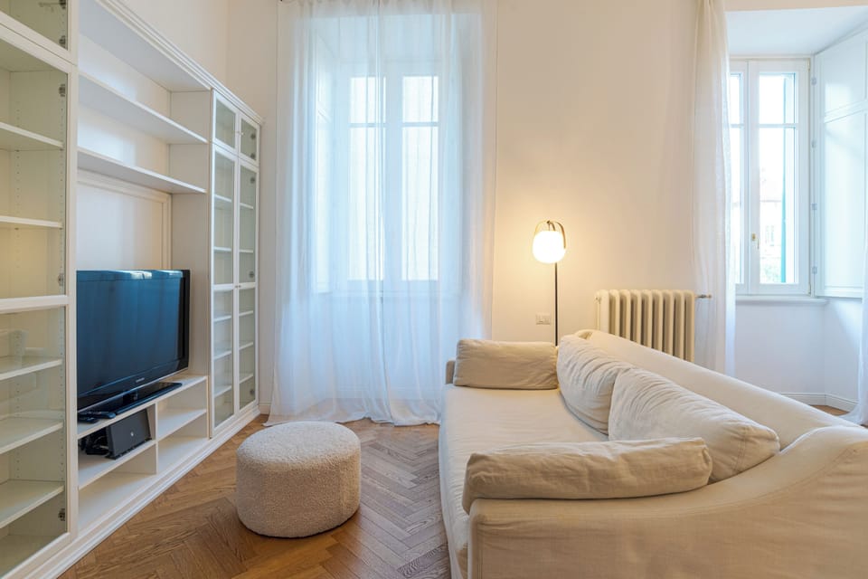 Family Apartment, Multiple Bedrooms (Appartamento Reggenza) | Living room | 21-inch flat-screen TV with digital channels, TV