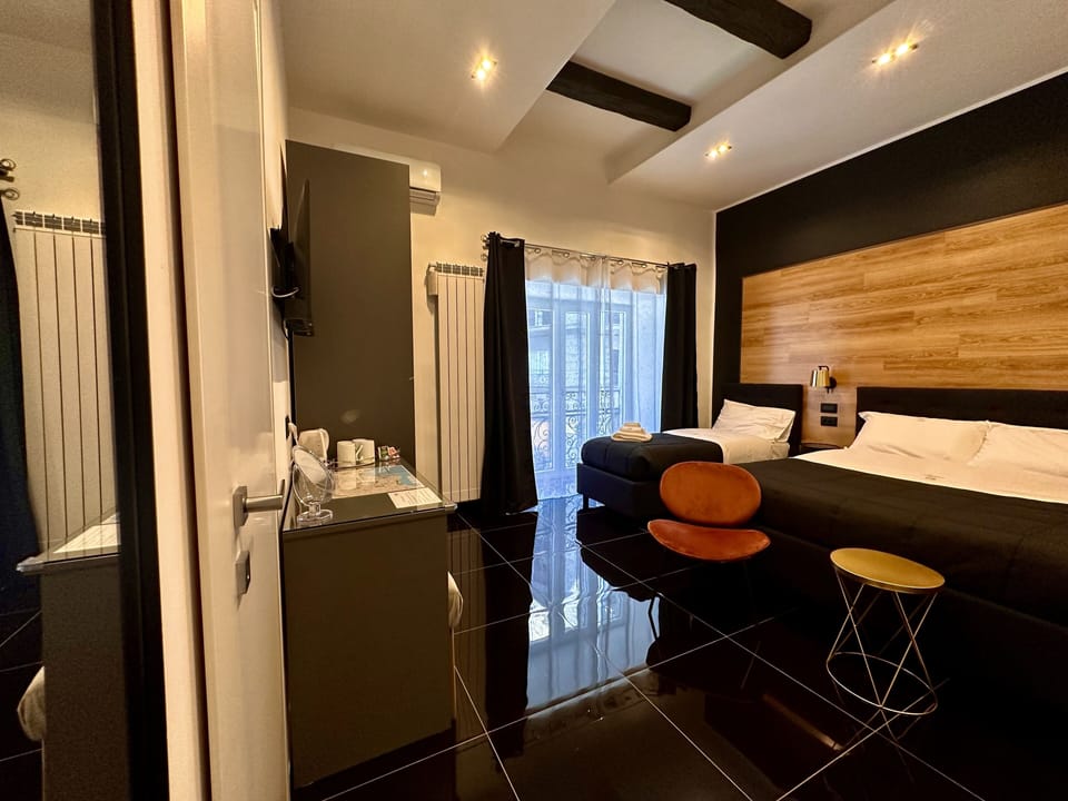 Deluxe Quadruple Room | In-room safe, desk, blackout drapes, soundproofing