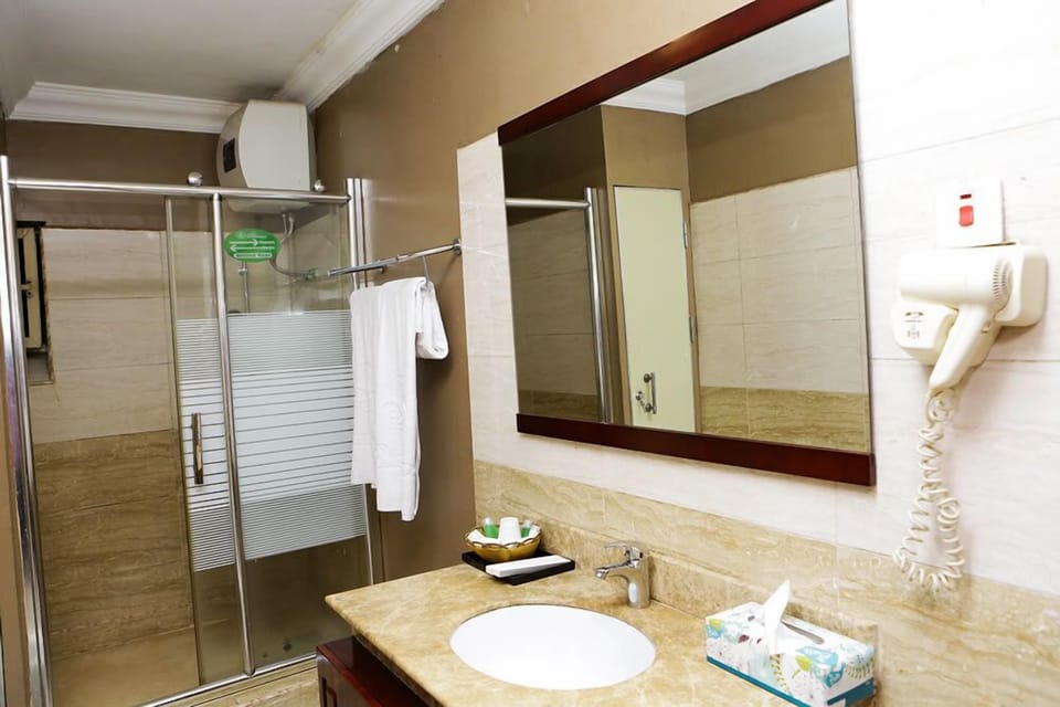Family Room | Bathroom | Shower, rainfall showerhead, free toiletries, slippers