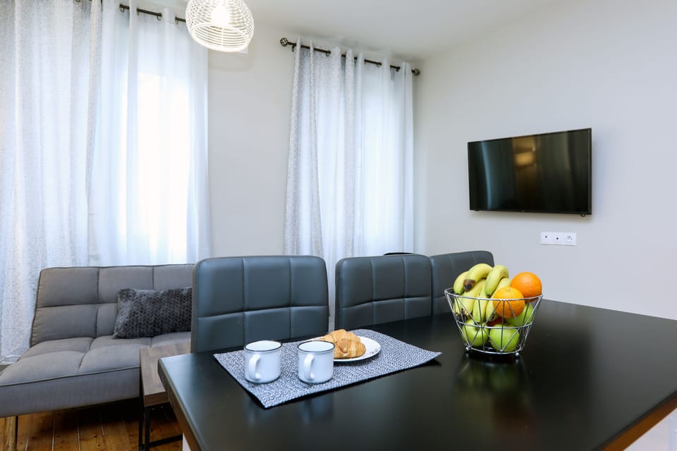 City Apartment | Living area | 42-inch LCD TV with cable channels