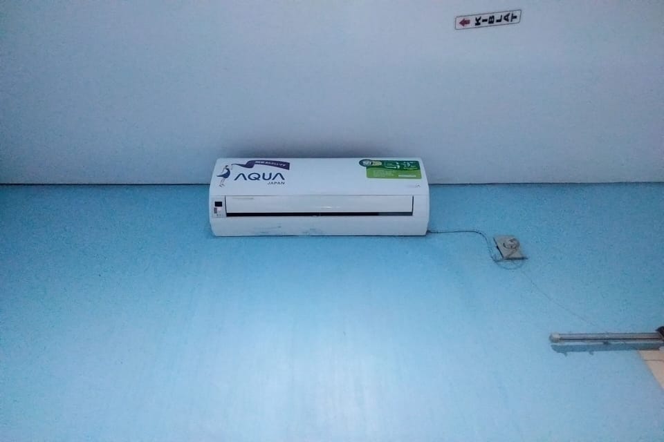 Desk, laptop workspace, bed sheets