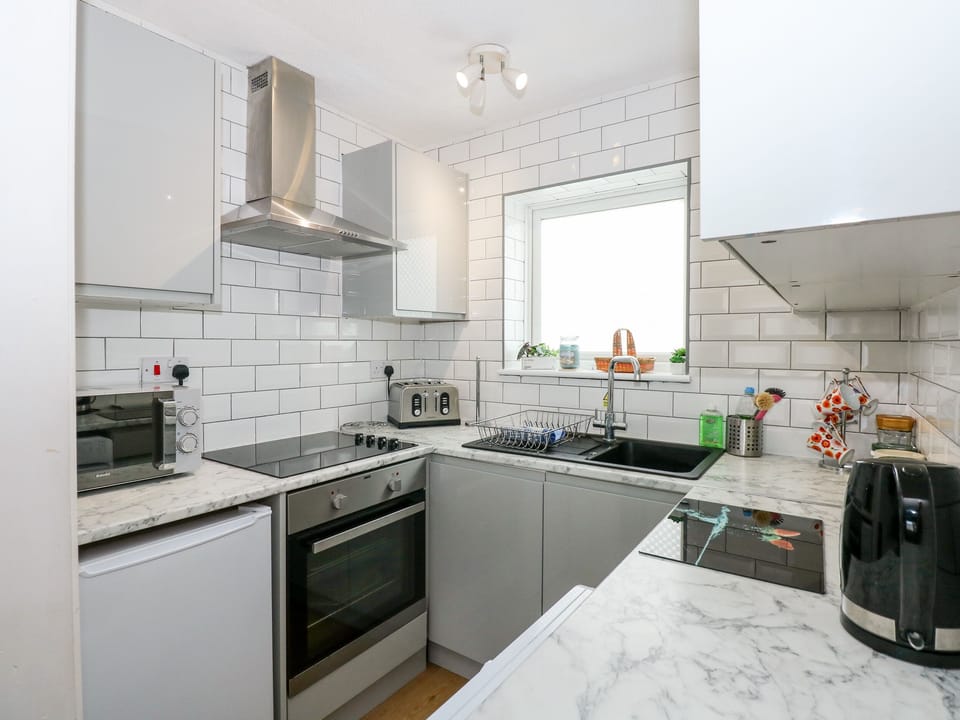Fridge, electric kettle, toaster, cookware/dishes/utensils