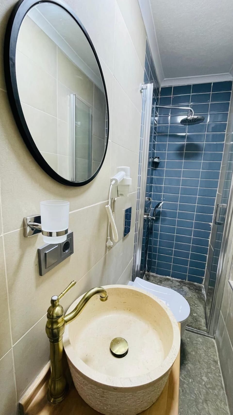Shower, free toiletries, hair dryer, slippers