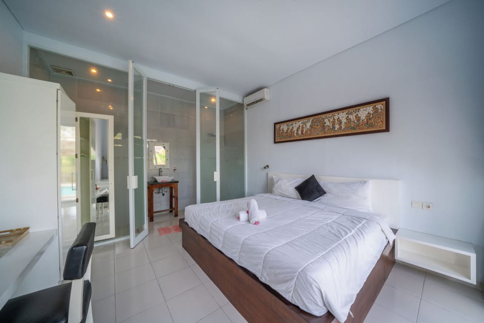 Deluxe Suite, 1 Bedroom, Non Smoking, Pool View | Down comforters, memory foam beds, minibar, individually decorated