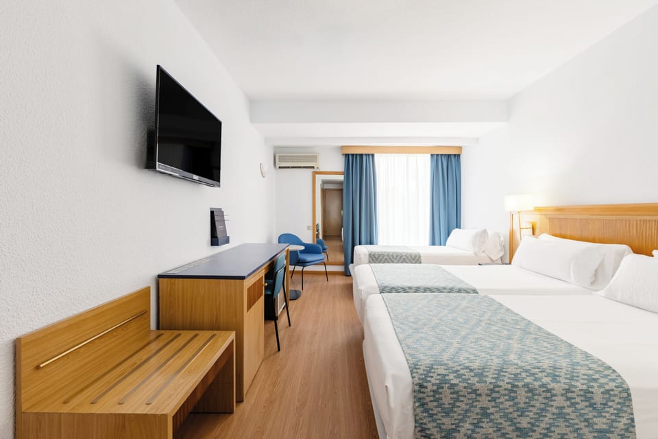 Triple Room (3 adults) | Minibar, in-room safe, blackout drapes, free WiFi