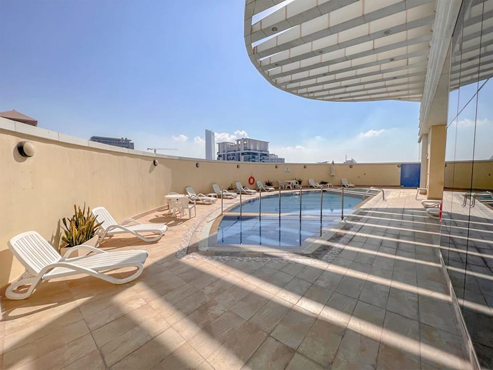 Outdoor pool, sun loungers, lifeguards on site
