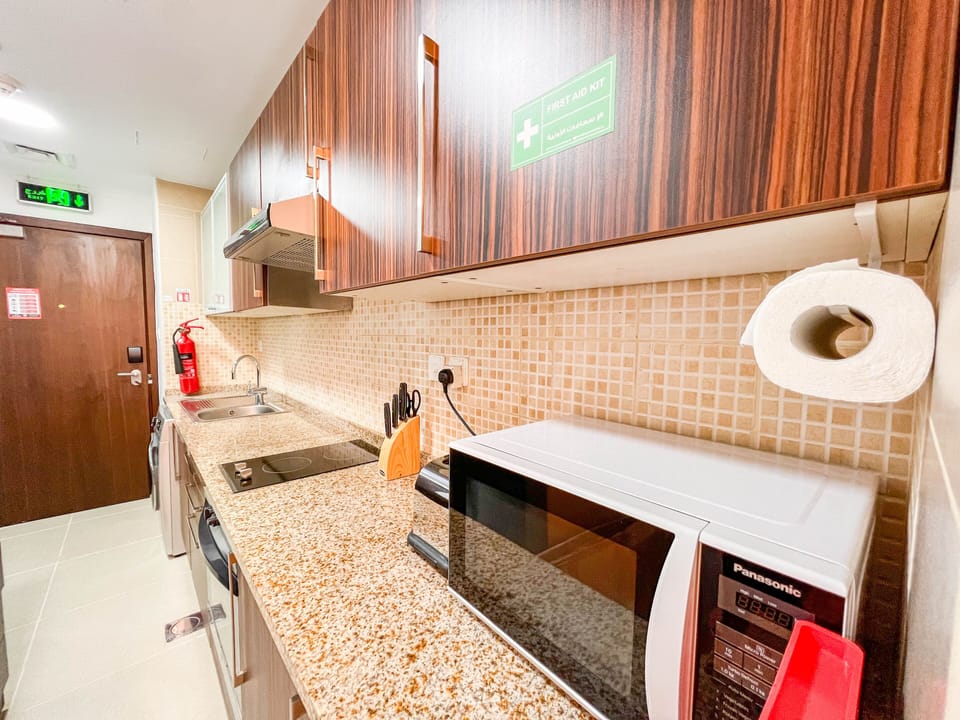 Luxury Studio | Private kitchen | Full-size fridge, microwave, oven, electric kettle
