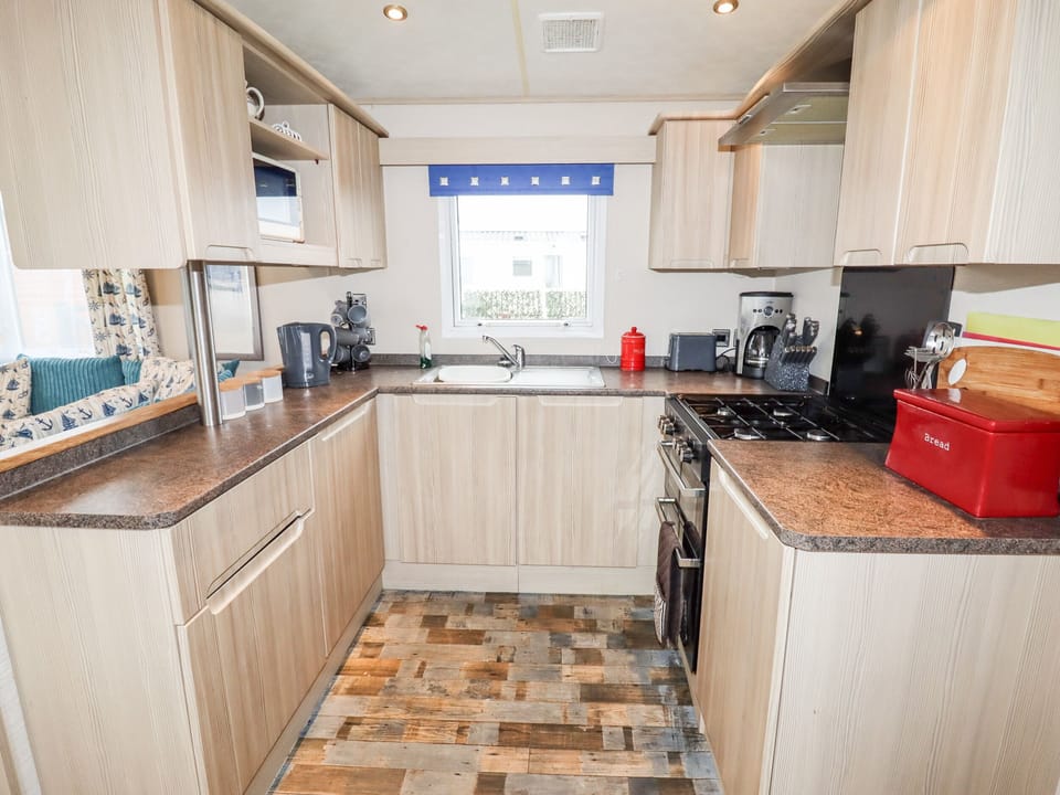 Fridge, electric kettle, toaster, cookware/dishes/utensils