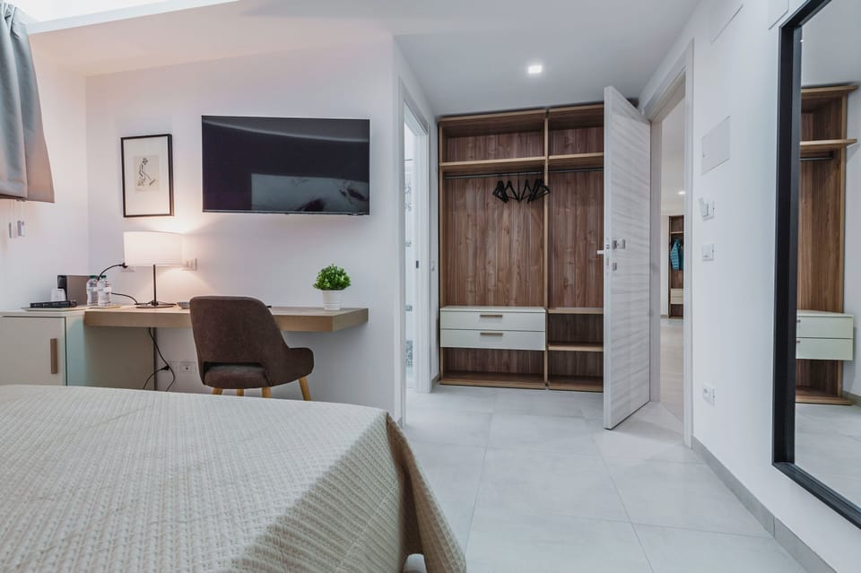 Deluxe Room | Individually furnished, desk, laptop workspace, blackout drapes