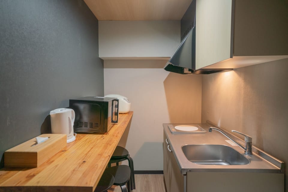 Deluxe Villa | Private kitchen | Full-size fridge, microwave, stovetop, electric kettle