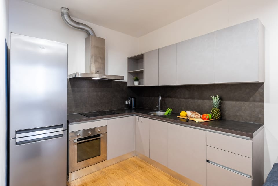 Business Apartment | Private kitchen | Full-size fridge, stovetop, coffee/tea maker, electric kettle
