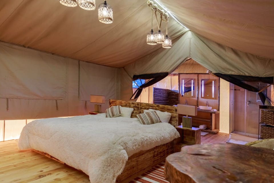 Deluxe Tent | Down comforters, memory foam beds, in-room safe, individually furnished