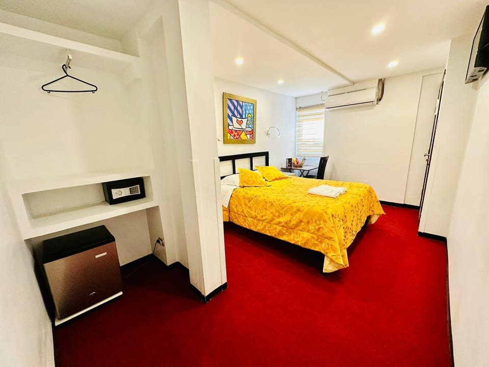 Premium bedding, down comforters, free minibar items, in-room safe