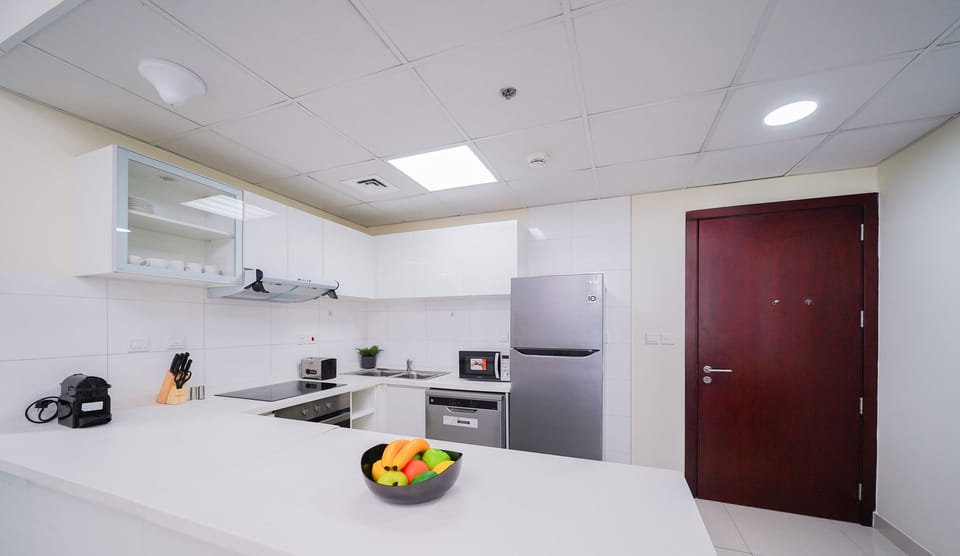 Deluxe Apartment | Private kitchen | Full-size fridge, microwave, oven, dishwasher