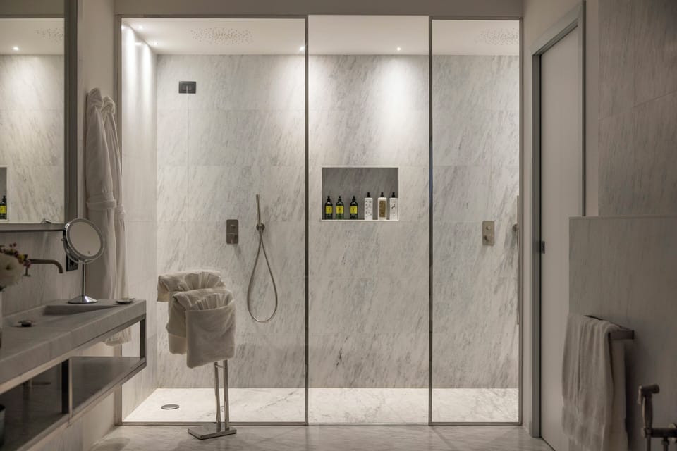 Spa Suite | Bathroom | Shower, rainfall showerhead, designer toiletries, hair dryer