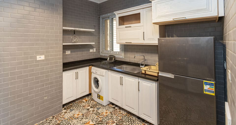 Standard Apartment, 2 Bedrooms | Private kitchen | Full-size fridge, microwave, electric kettle, cookware/dishes/utensils