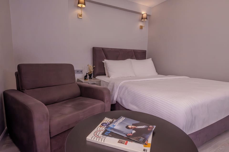 Superior Room with Balcony | Living area | 49-inch Smart TV with digital channels