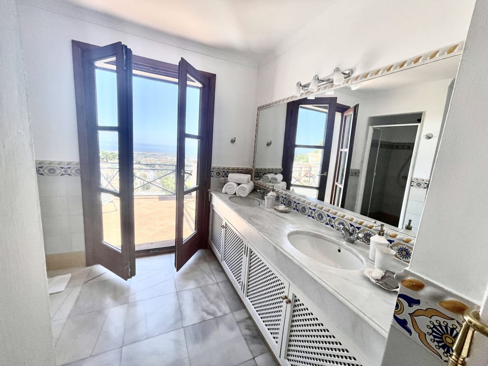 Separate tub and shower, hair dryer, bidet, towels