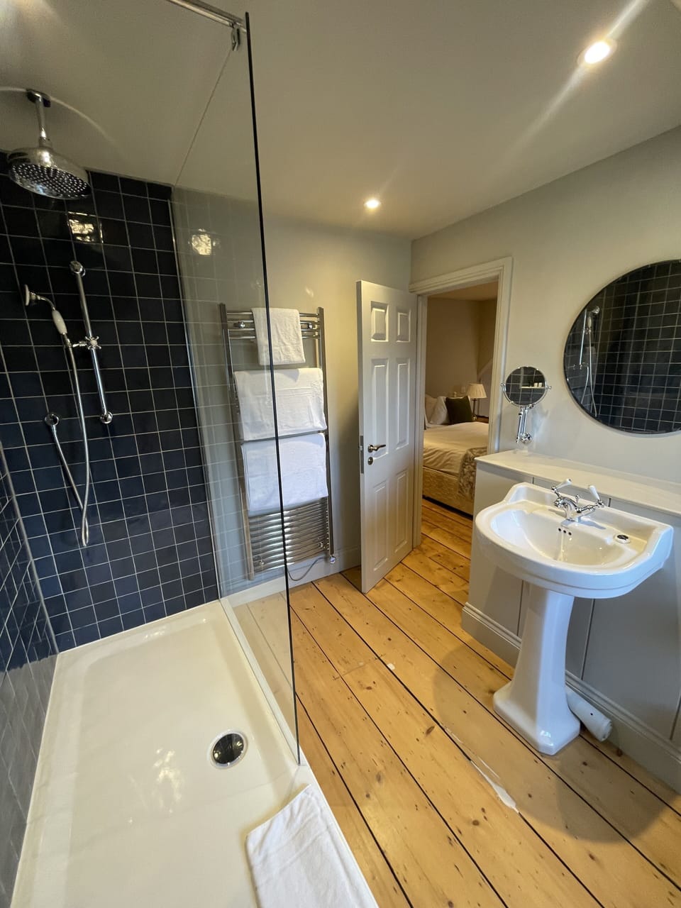 Deluxe Room, 1 King Bed | Bathroom | Combined shower/tub, hair dryer, towels