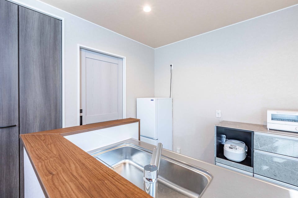 Comfort Villa | Private kitchen | Full-size fridge, microwave, stovetop, electric kettle