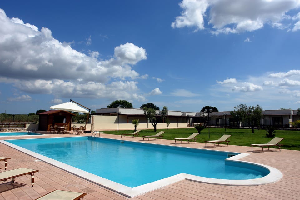 Seasonal outdoor pool, open 9 AM to 6 PM, pool umbrellas, sun loungers