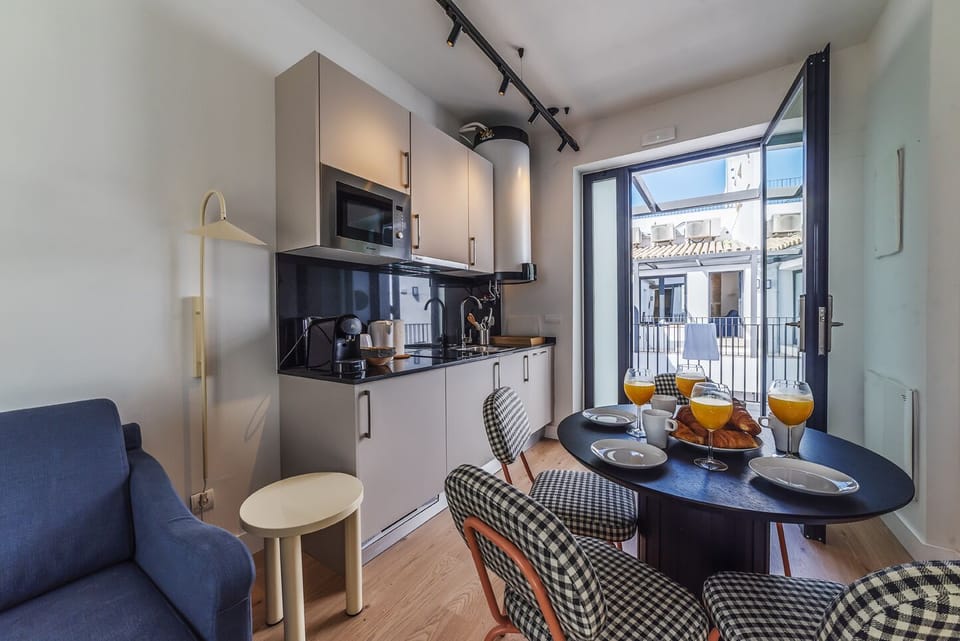 Superior Apartment | Living area | 50-inch Smart TV with satellite channels