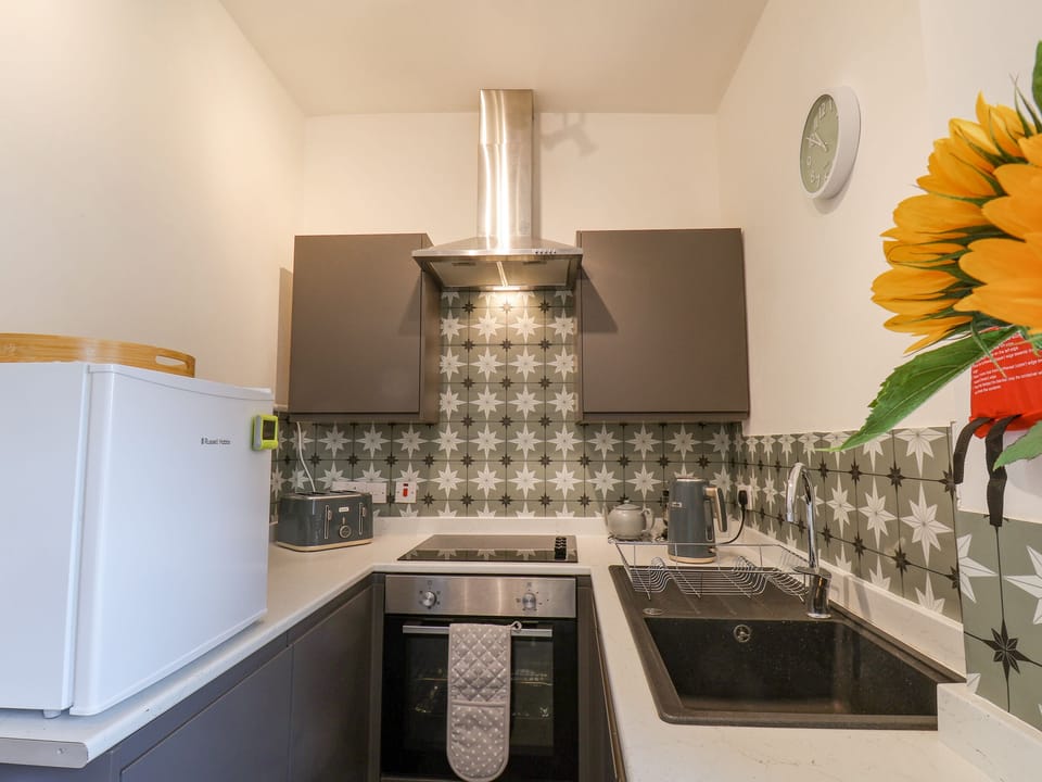 Fridge, electric kettle, toaster, cookware/dishes/utensils