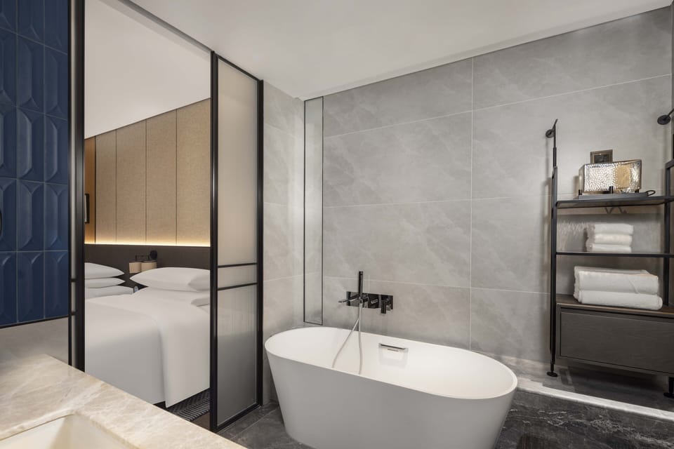 Separate tub and shower, rainfall showerhead, hair dryer, bathrobes