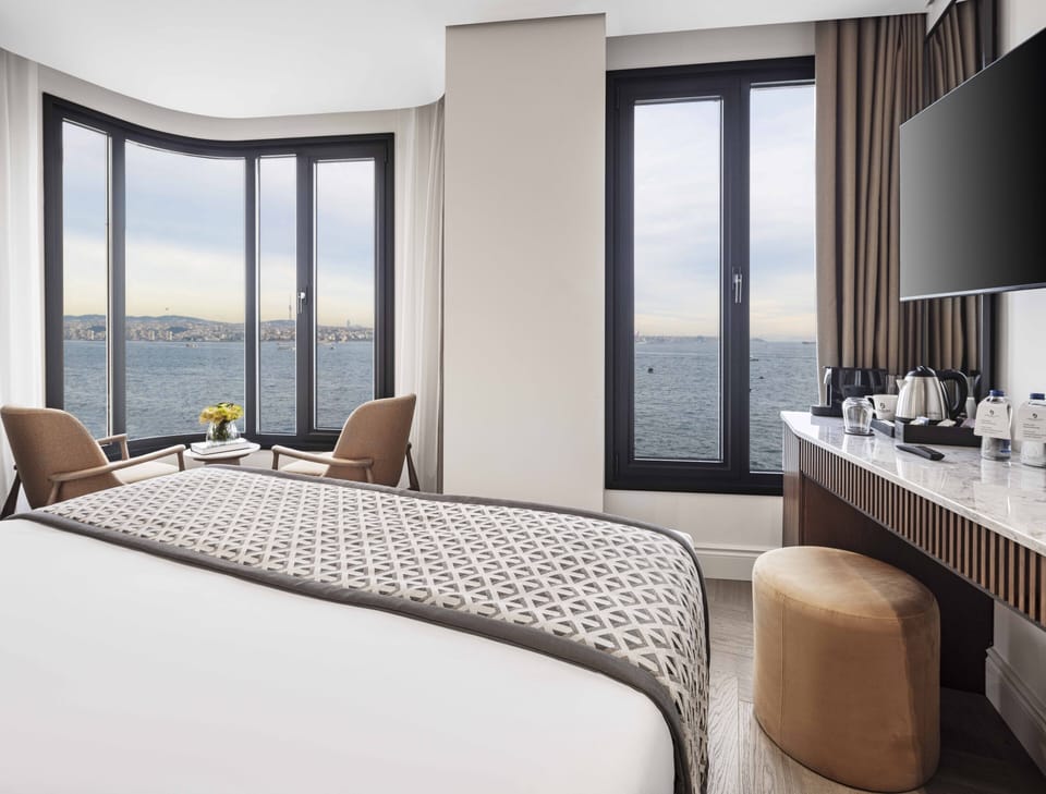 Suite, Sea View, Corner | Minibar, in-room safe, desk, soundproofing