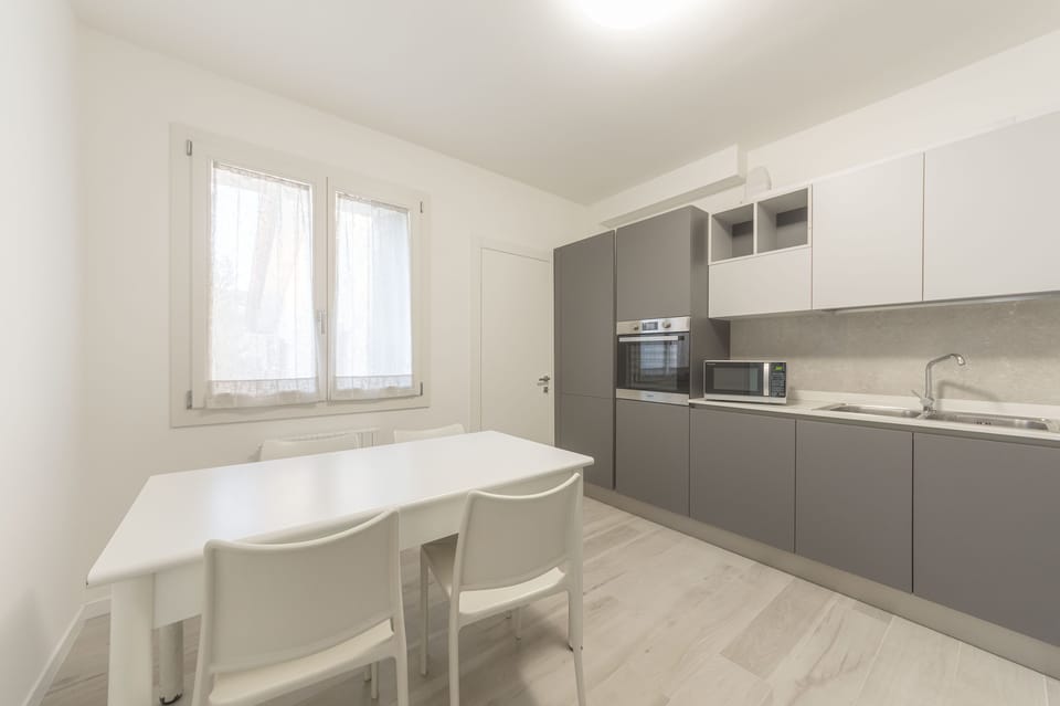 Comfort Apartment | Private kitchen | Full-size fridge, microwave, oven, stovetop