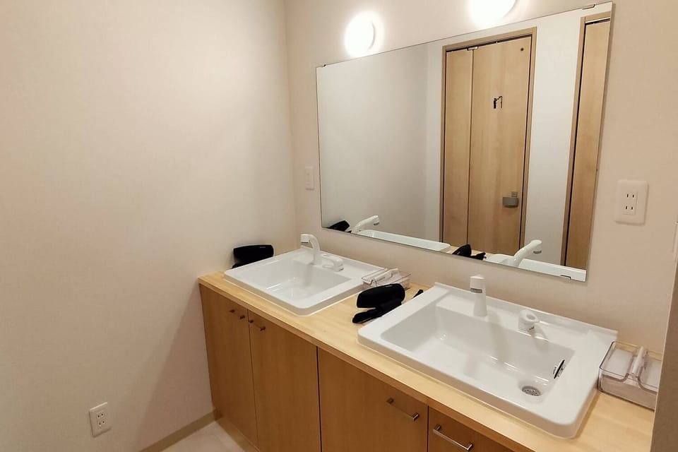 Economy Cabin | Bathroom | Shower, hair dryer, slippers, towels