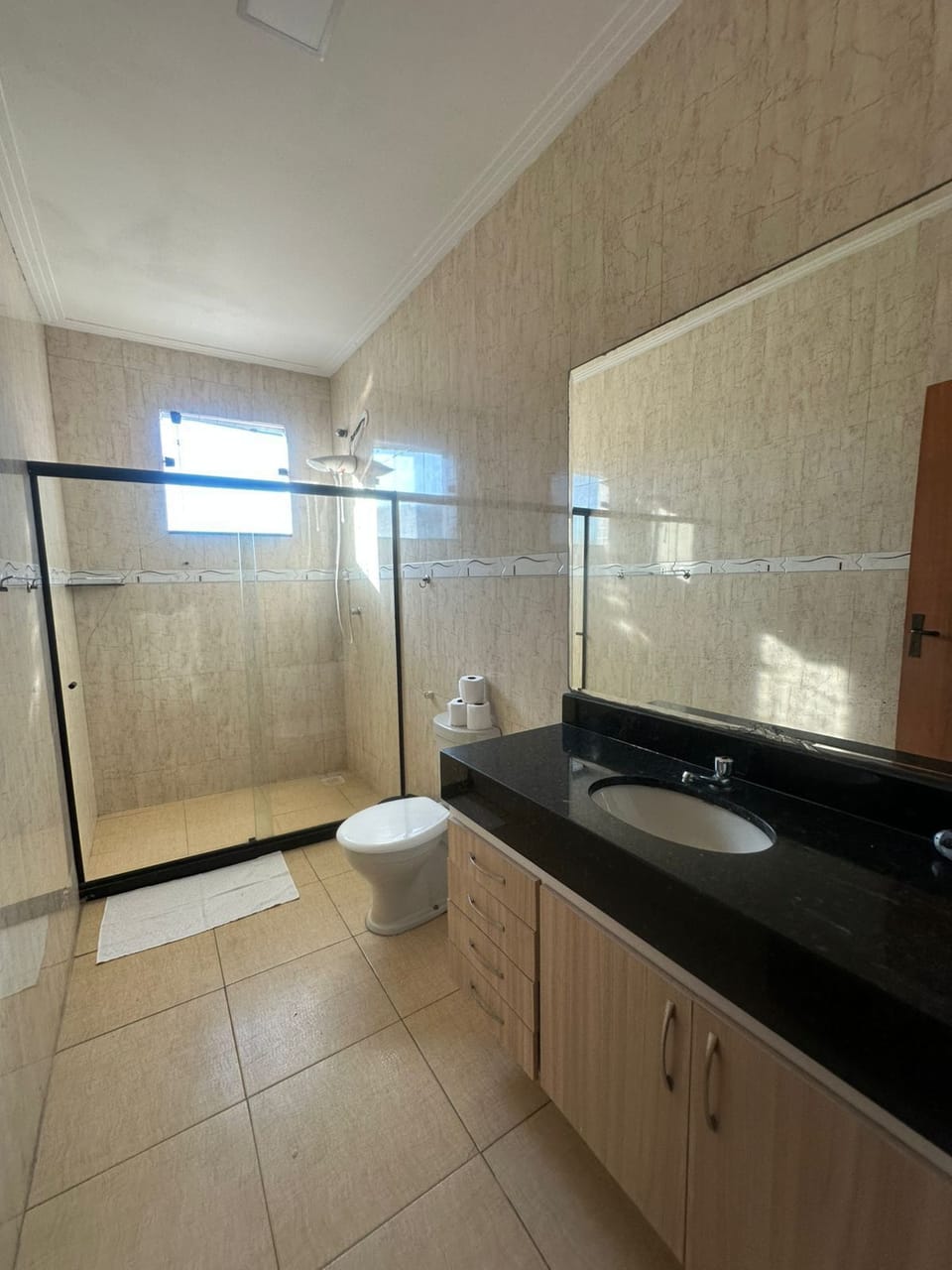 Shower, rainfall showerhead, hair dryer, towels